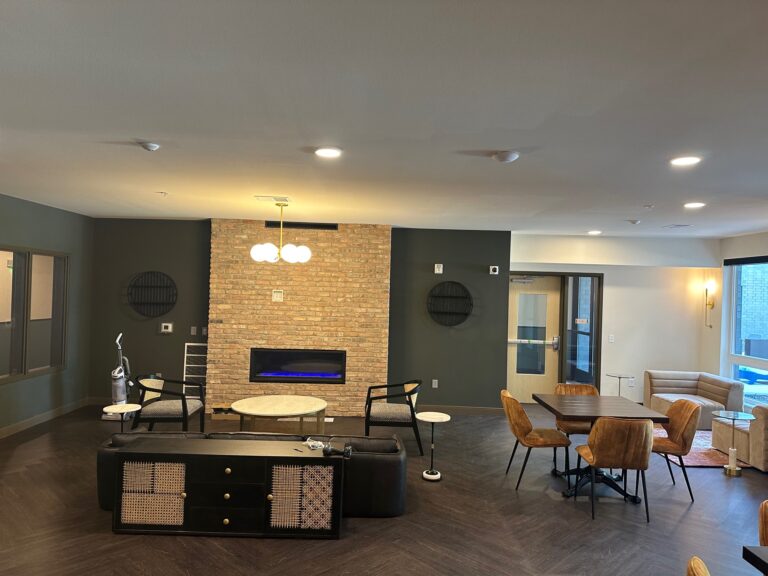 Painter completing a unit turnover repaint in a Madison, WI apartment community